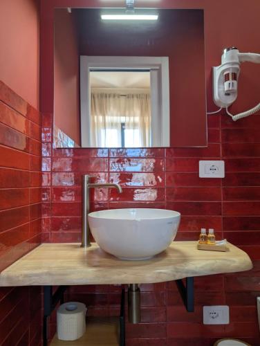 a bathroom with a sink and a mirror at La Sosta del Cardinale in Montefiascone