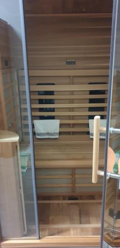 a closet with a shelf with towels on it at Zimmer mit Doppelbett in Zagreb