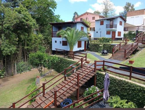 a house with wooden stairs in front of a house at Sole Luna in Río Ceballos