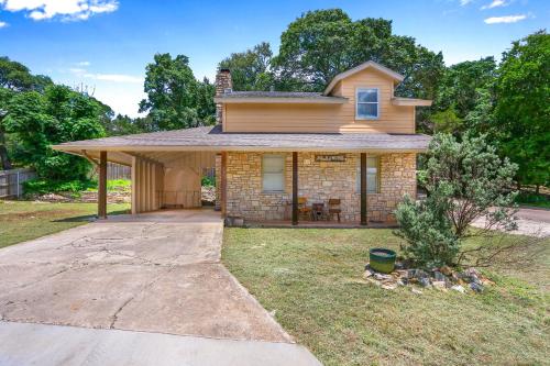 a small brick house with a large driveway at Mi Rancho in Wimberley