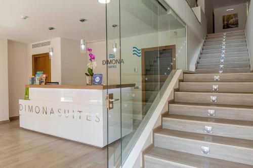 a store with a staircase and a glass wall at BLUESEA Dimona Suites in Torremolinos