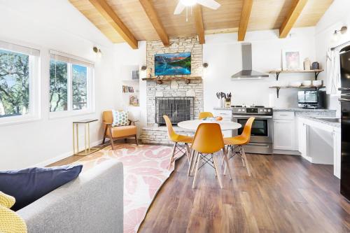 a kitchen and living room with a table and chairs at Millies Cottages Unit 1 - Ruth in Canyon Lake