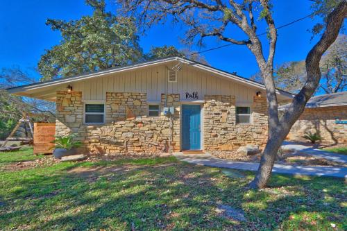 a stone house with a blue door at Millies Cottages Unit 1 - Ruth in Canyon Lake