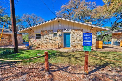 a stone house with a sign in front of it at Millies Cottages Unit 2 - Annie in Canyon Lake