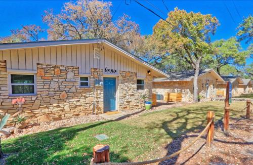 a stone house with a blue door at Millies Cottages Unit 2 - Annie in Canyon Lake