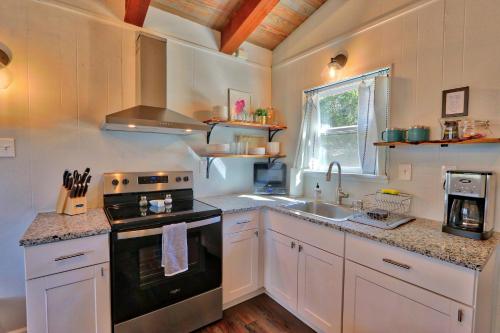 a kitchen with a stove and a sink at Millies Cottages Unit 2 - Annie in Canyon Lake