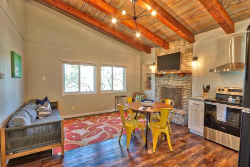 a kitchen and living room with a table and chairs at Millies Cottages Unit 3 - Phyllis in Canyon Lake