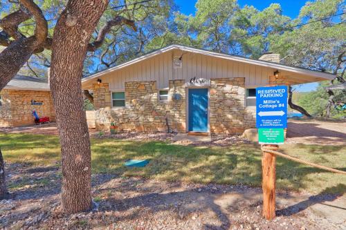 a house with a sign in front of it at Millies Cottages Unit 4 - Clara in Canyon Lake