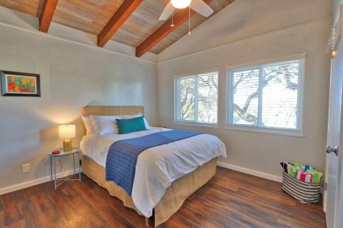a bedroom with a bed and a window at Millies Cottages Unit 5 - Josephine in Canyon Lake