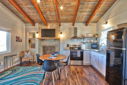 a kitchen with a table and a dining room at Millies Cottages Unit 5 - Josephine in Canyon Lake