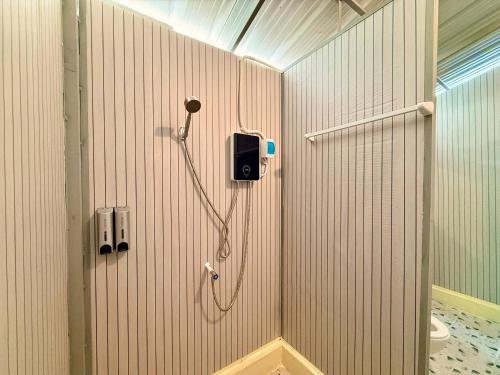 a bathroom with a shower with a shower at Kohrong Central Beach in Koh Rong Island