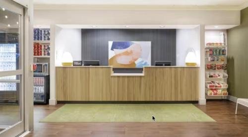 a check in counter in a store at Spark by Hilton Charlotte Airport North in Charlotte