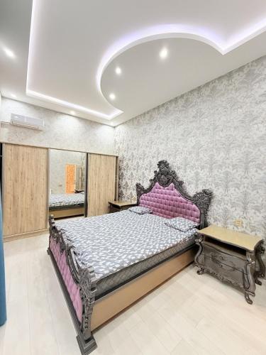a bedroom with a large bed in a room at Novxanı Villa in Baku