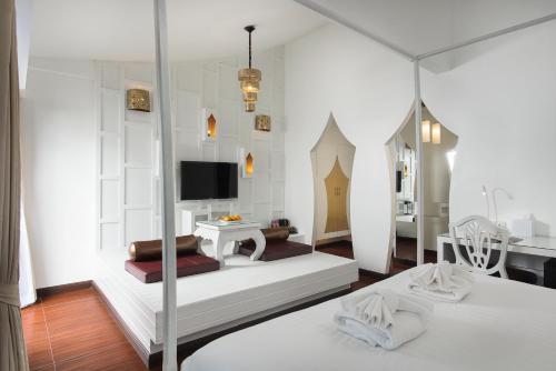 โทรทัศน์และ/หรือระบบความบันเทิงของ Nimman Mai Design Hotel Chiang Mai - SHA Plus