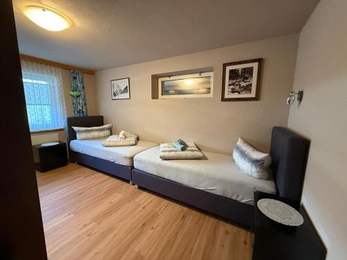 a room with two beds in a room at ISIS---Ferienwohnung in Steinach am Brenner