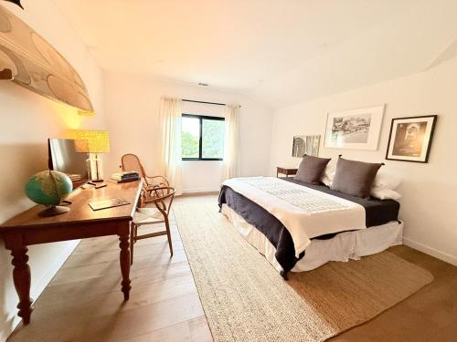 a bedroom with a bed and a desk and a desk at Private Hillside 2BR Suite Near Town in Ojai