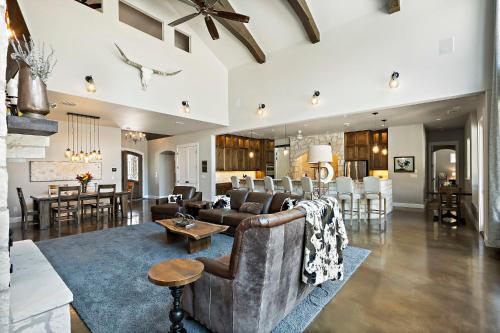 a living room with a couch and a table at Big Red Chicken Estate in Wimberley