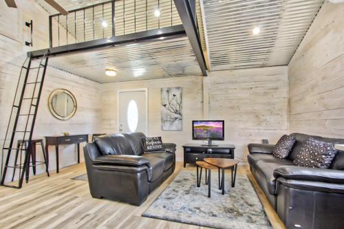 a living room with leather furniture and a bar at Blue Jay Getaway in Blanco