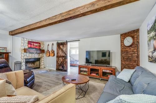 a living room with a couch and a table at Bungalow on the Bluff in Fischer