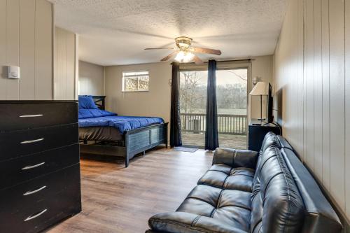 a living room with a couch and a bed at Warren County Launchpad: Pet-Friendly Lebanon Apt in South Lebanon