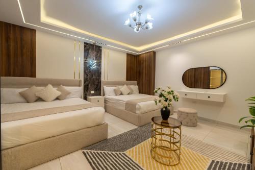 a living room with two beds and a couch at The Muse Luxury View Hotel in Cairo