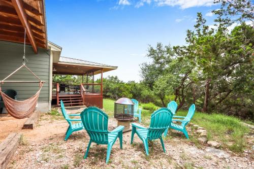 a group of chairs sitting on a patio at Canyon Breeze in Canyon Lake