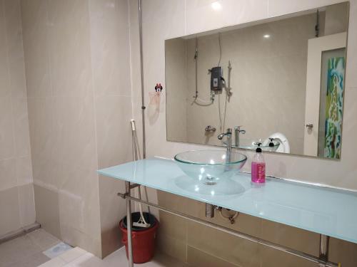 a bathroom with a sink and a mirror at park view Service Apartment near KLCC in Kuala Lumpur