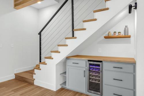 a kitchen under the stairs with a refrigerator at Jalsa in Wimberley