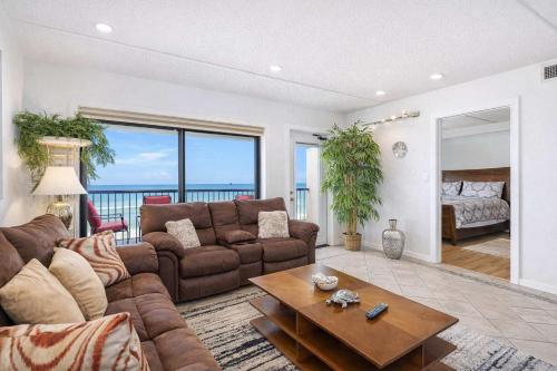 a living room with a couch and a table at Saida Towers III- 3101 condo in South Padre Island