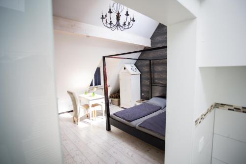 a bedroom with a bed and a desk at Altstadtloft am Kaulberg in Bamberg