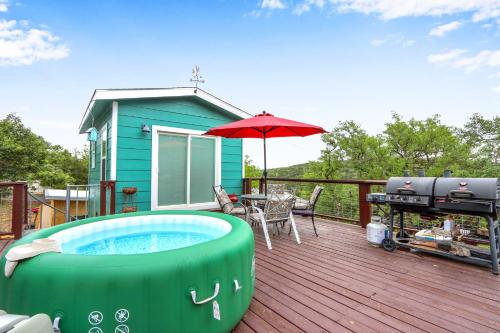 a hot tub on the deck of a house at Coop at Canyon Lake in Canyon Lake