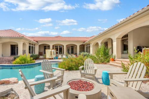 a backyard with chairs and a swimming pool at Narwhal Ranch in Wimberley