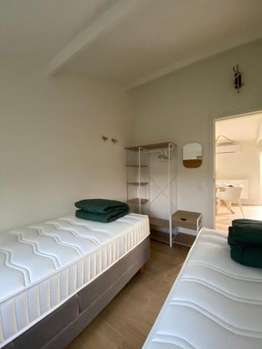 a bedroom with two beds in a room at Sea & Stay Bredene Zeewind 2 in Bredene