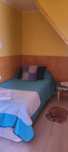 a bedroom with two beds in a room at CABAÑAS RINCON SOLEADO, Chile Chico in Chile Chico