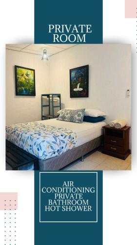 a poster for a private room with a bed in a bedroom at Nicte Guesthouse in Flores