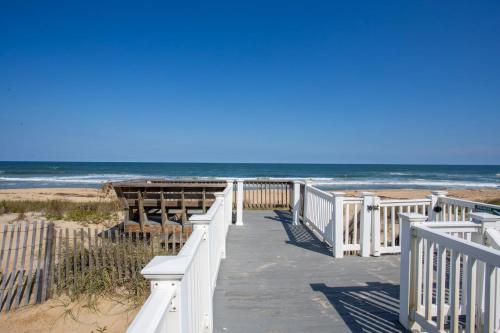 a boardwalk to the beach with the ocean in the background at 4000 - Fragile Magic in Kitty Hawk