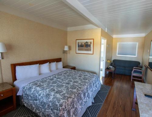 a hotel room with a bed and a couch at Pacific Heights Inn in San Francisco