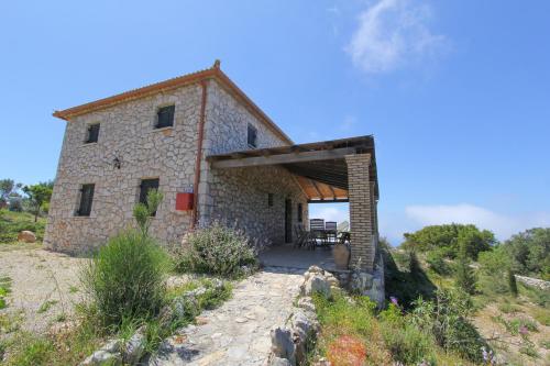 an external view of a stone house on a hill at Villa Katerina in Chania