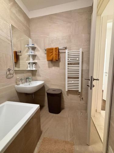 a bathroom with a sink and a bath tub at Tower II in Banja Luka