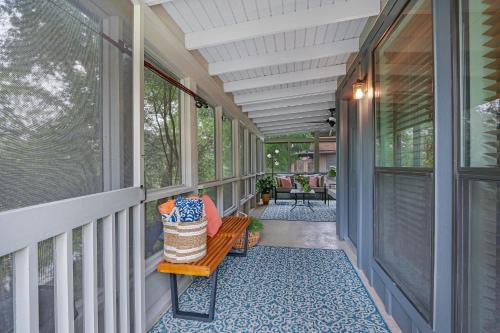 a porch with a bench on a house at Lily Pad in Wimberley