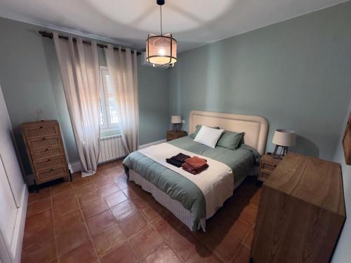 a bedroom with a bed and a lamp in it at La Casa de los Limones in Montilla