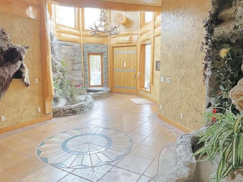a large room with a tile floor and a hallway at Granite Ridge Lodge in Keystone