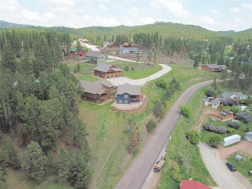 an aerial view of a house and a road at Iron Horse Lookout in Hill City
