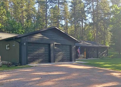 a black garage with a flag in front of it at Keystone Crossing in Keystone