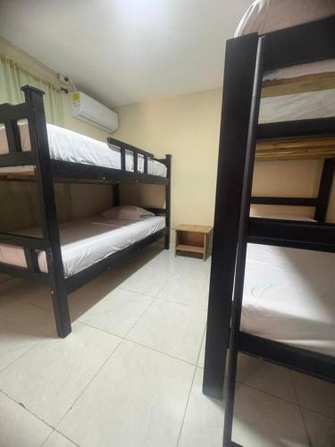 a room with three bunk beds in a room at Apartamentos KARS in Ríohacha