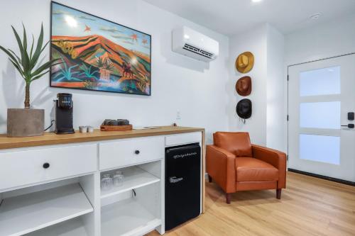 a living room with a desk and a chair at Cowboy Casita in Wimberley