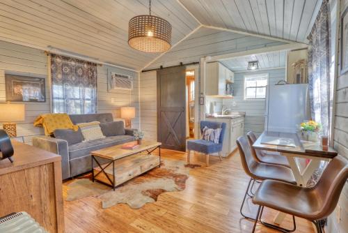 a living room with a couch and a table at Creekside Cabins - The Texan in Wimberley