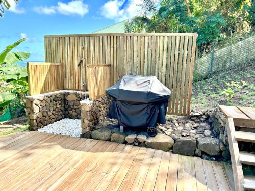 a backyard with a wooden fence and a tent at Villa Tiare in Bora Bora