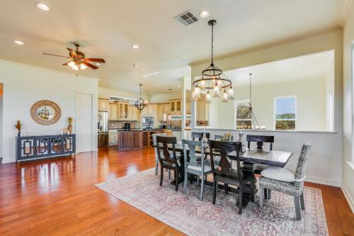a dining room and kitchen with a table and chairs at Riviera Lake House in Canyon Lake