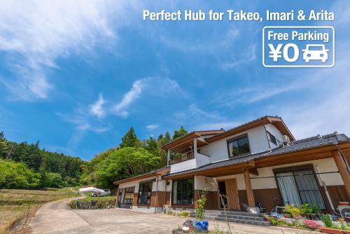 a house in the mountains with a blue sky at Share Creative&Bed adonoan in Takeo